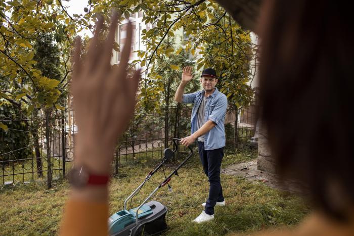 people-helping-neighbors-with-grass-lawn