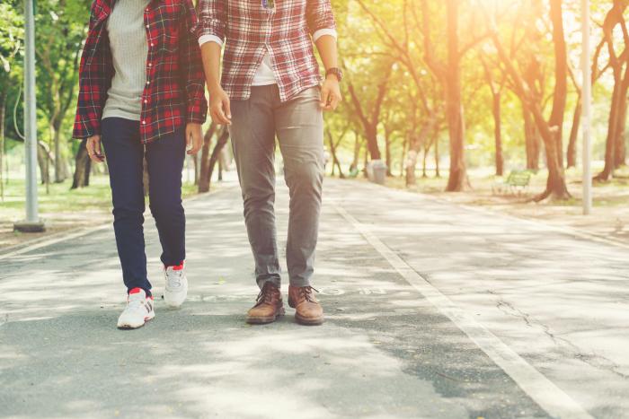 young-teenagers-couple-walking-together-in-park-relaxing-holida