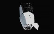 Fotografía cedida por la NASA donde se observa a la cápsula de carga Dragon de SpaceX, con su cono frontal abierto, mientras se aproxima al módulo Harmony de la Estación Espacial Internacional para acoplarse.