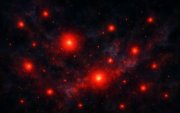 Puntos. James captó en el año 2022 los misteriosos puntos rojos en el universo primitivo.