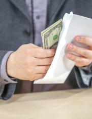 young-businessman-working-from-his-office-counting-cash-money