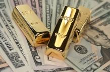 gold-bars-on-us-dollar-bills
