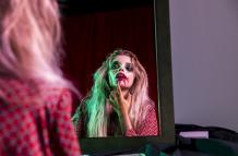 woman-fixing-her-lipstick-for-halloween-night