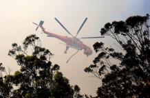 Un incendio forestal arrasa con varias casas en rápida expansión en Australia