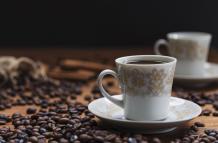 cup-saucer-near-coffee-beans