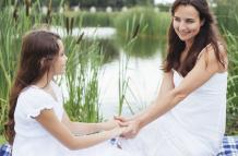 mother-daughter-holding-hands-by-lake