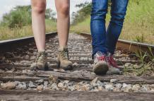 leg-view-couple-walking-train-tracks