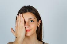 young-lady-holding-hand-eye-looking-cheerful-front-view
