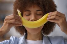 front-view-woman-holding-banana