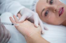 doctor-injecting-woman-her-palm