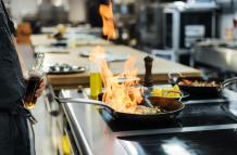 side-view-chef-flambeing-dish-kitchen