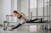 woman-practising-pilates-pilates-reformer