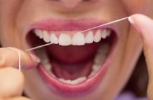 female-patient-flossing-her-teeth