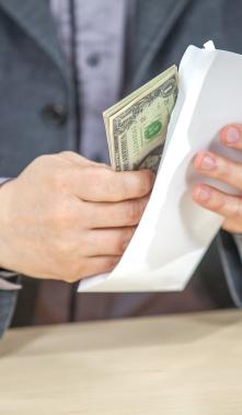 young-businessman-working-from-his-office-counting-cash-money