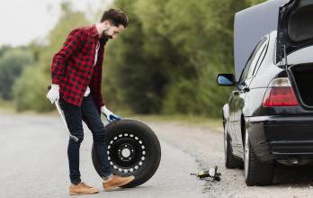 side-view-of-man-with-spare-tire