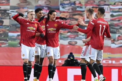 Los jugadores del Manchester United disfrutan la victoria ante el Liverpool.