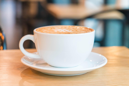 hot caramel macchiato in coffee shop