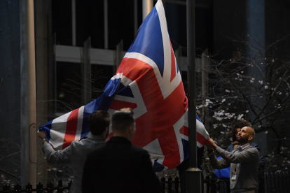 Staff members take down the United Kingdom"s flag from the European Parliament building in Brussels on Brexit Day, January 31, 2020. - Britain leaves the European Union at 2300 GMT on January 31, 2020, 43 months after the country voted in a June 2016 referendum to leave the block. The withdrawal from the union ends more than four decades of economic, political and legal integration with its closest neighbours. (Photo by JOHN THYS / AFP)