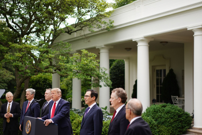 US President Donald Trump holds a press conference on China on May 29, 2020, in the Rose Garden of the White House in Washington, DC. With Trump are (L-R) Director of Trade and Manufacturing Policy Peter Navarro, National Security Advisor Robert O"Brien, US Secretary of State Mike Pompeo, US Secretary of the Treasury Steven Mnuchin, Trade Representative Robert Lighthizer, and Director of the National Economic Council Larry Kudlow. Trump said Friday that the US will restrict Chinese students and start reversing Hong Kong"s special status in customs and other areas as Beijing imposes a controversial security law. / AFP / MANDEL NGAN

 US-China-diplomacy-HEALTH-VIRUS-HongKong-TRUMP