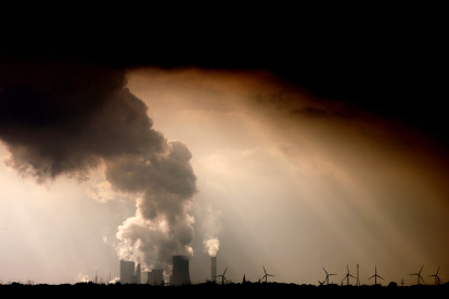 Picture taken on September 30, 2009 shows smoke and vapor rising from the cooling towers and chimneys of the lignite-fired power plant Niederaussem run by German energy supplier RWE near Bergheim, western Germany.
Peruvian farmer Saul Luciano Lliuya accuses German energy giant RWE of contributing to climate change that is threatening his home and livelihood in the Andes. A lower court in the western city of Essen where RWE is based dismissed the initial lawsuit in December 2016, ruling that Luciano had failed to demonstrate a direct link between the German utility and the flood risk. Luciano, who is also a mountain guide, is now hoping the higher court in the city of Hamm will side with him in what German media have likened to a "David versus Goliath" battle. The appeal hearing started on November 13, 2017. / AFP PHOTO / dpa / Oliver Berg / Germany OUT