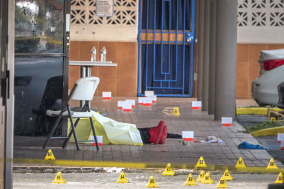 A victim"s body is seen at the shooting scene at entrance of the Billiards banquet hall in Miami Gardens, Florida, USA,