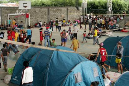 Fotografía de archivo de migrantes venezolanos en un centro de integración ciudadana de Arauquita, localidad fronteriza y perteneciente al departamento de Arauca (Colombia).