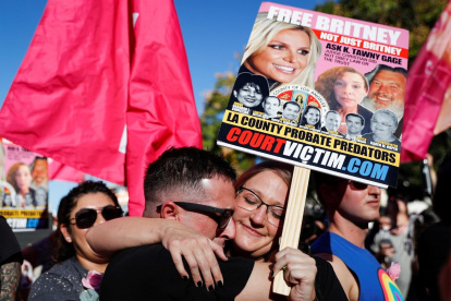Aaron Morris (L) and Elizabeth Crocker (R) embrace upon hearing the news that Britney Spears"Äô conservatorship has been terminated, at the Stanley Mosk Courthouse in Los Angeles, California, USA, 12 November 2021.