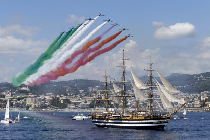 Genoa (Italy), 01/07/2023.- Planes release smoke in the colors of the Italian flag over the ship "Amerigo Vespucci" as it leaves from Genoa on world tour, Genoa, Italy, 01 July 2023. Italian naval academy flagship sailboat Amerigo Vespucci, one of the world"s most iconic "tall ships", is to take Italian products in "Made in Italy" global tour for 20 months visiting 28 countries and 31 ports. (Italia, Génova) EFE/EPA/MASSIMO PERCOSSI