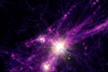 Concepción artística de las primeras galaxias con brote estelar. La imagen se ha obtenido a partir de los datos de simulación FIRE utilizados para esta investigación. Las estrellas y galaxias se muestran en los puntos de luz blanca brillante, mientras que la materia oscura más difusa y el gas se muestran en morados y rojos.