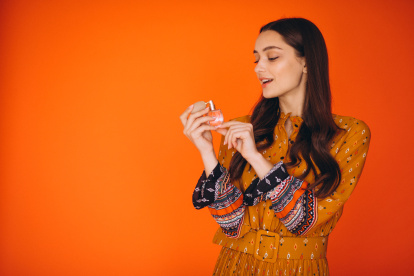 Young woman in a beautiful yellow dress in studio