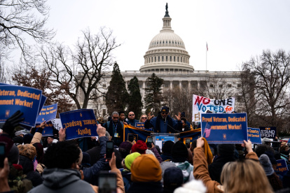 WASHINGTON, DC - FEBRUARY 11: People listen as Everett Kelley, President of the American Federation of Government Employees (AFGE) Union, during a "Save the Civil Service" rally outside the U.S. Capitol on February 11, 2025 in Washington, DC. Unionized federal workers and members of congress denounced President Trump and his alliesincluding Elon Musk, head of the so-called "Department of Government Efficiency" (Doge)for purging federal prosecutors, forcing out civil servants with dubious buyouts, and attempting to shutter USAID, all while branding government employees the "enemy of the people."   Kent Nishimura/Getty Images/AFP (Photo by Kent Nishimura / GETTY IMAGES NORTH AMERICA / Getty Images via AFP)