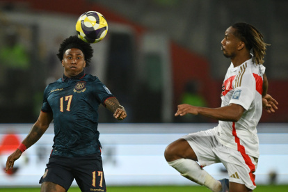 Ecuador"s defender #17 Angelo Preciado and Peru"s  midfielder  #18 Andre Carrillo fight for the ball during the 2026 FIFA World Cup South American qualifiers football match between Peru and Ecuador at the National stadium in Lima, on June 10, 2025. (Photo by ERNESTO BENAVIDES / AFP)