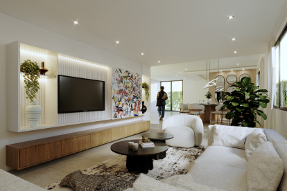 En una sala minimalista,  decore las paredes con arte colorido y complemente con plantas naturales y cojines de distintas texturas.