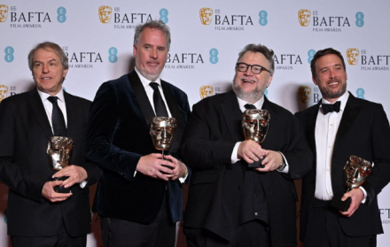 Guillermo del Toro (second right), Mark Gustafson, Gary Ungar and Alex Bulkley pose with the award for Animated Film for Guillermo Del Toro's Pinocchio
