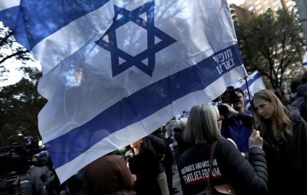A woman holds an Israeli flag during a candlelight vigil for Israeli victims in New York, New York, USA, 01 November 2023. Thousands of Israelis and Palestinians have died since the militant group Hamas launched an unprecedented attack on Israel from the