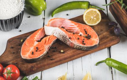 salmon-fillet-wooden-board-with-lemon-tomato-with-green-chilies