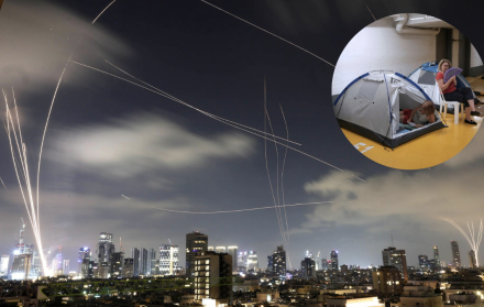 Residentes de Tel Aviv corren hacia refugios tras activarse una alarma antiaérea por misiles iraníes
