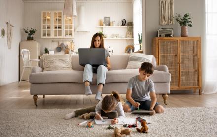 mother-working-laptop-full-shot