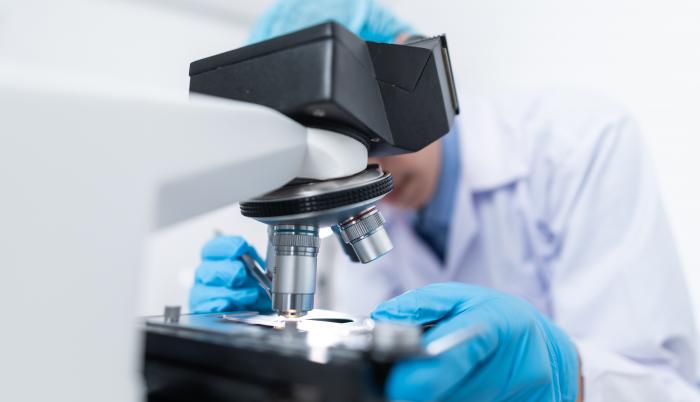 scientist-using-microscope-3938022