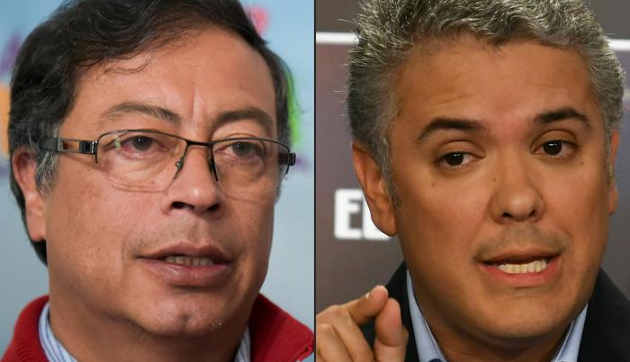 Con el 100 % escrutado, Duque (der) obtuvo 7.569.693 votos (39,14 %), un primer lugar que le permite ir a segunda vuelta el 17 de junio con una ventaja de 2,7 millones de papeletas sobre Petro (izq).