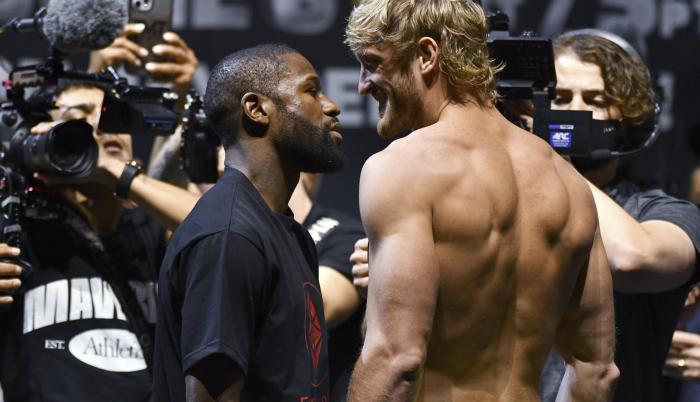 floyd-mayweather-logan-paul-weigh-in-faceoff-ap