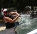 Una persona vandaliza un vehículo este martes, durante una protesta de integrantes de la Coordinadora Nacional de Trabajadores de la Educación (CNTE), en Chilpancingo (México).