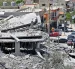 Edificios destruidos y vehículos sepultados tras un bombardeo en Líbano, horas antes de la prevista firma de paz.