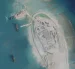 Pekín y Hanói avanzando posiciones lejos del ruido diplomático mediante la creación de islas artificiales.