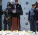 El ministro de Justicia y Seguridad de El Salvador, Gustavo Villatoro (c), fue captado este 8 de julio, durante la presentación de un cargamento de droga y de seis extranjeros detenidos en el operativo, en San Luis La Herradura (El Salvador).