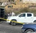 Policía Nacional acordonó la avenida Simón Bolívar tras el hallazgo del cuerpo. La investigación busca identificar a la víctima y esclarecer el crimen.