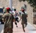 Medios desplegados intentan detener a un migrante este domingo 2 de agosto en Ceuta.