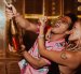Bruno Mars y Karol G celebrando el éxito de su nueva canción.
