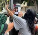Colectivos pegaron afiches por la desaparición de Kalindy Bolívar, investigadora ecuatoriana que desapareción en Ciudad de México.