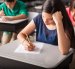 Group of high school students taking a test in a classroom